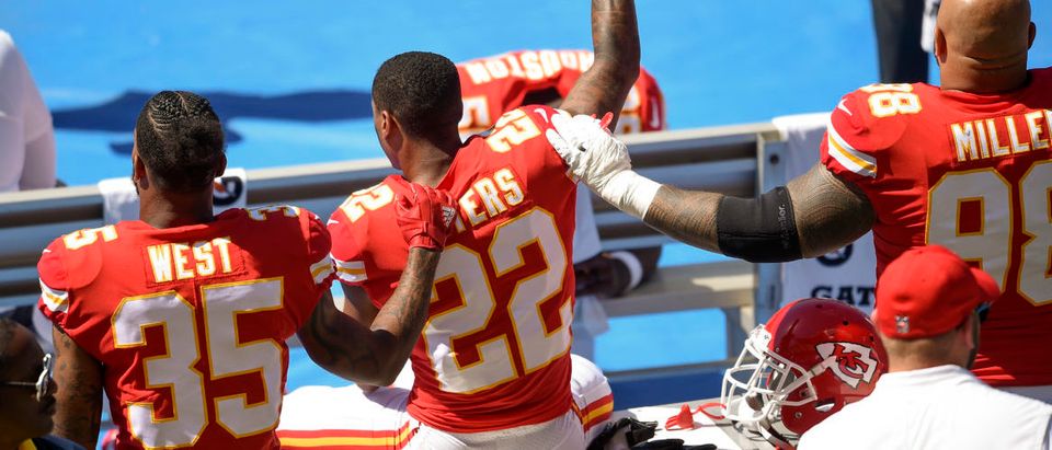 Sep 24, 2017; Carson, CA, USA; Kansas City Chiefs defensive back Marcus Peters (22) protests next to running back Charcandrick West (35) and defensive tackle Roy Miller (98) during the National Anthem prior to the game against the Los Angeles Chargers at StubHub Center.Kelvin Kuo-USA TODAY Sports/REUTERS)