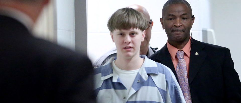 Dylann Roof is escorted into the court room at the Charleston County Judicial Center to enter his guilty plea on murder charges in state court for the 2015 shooting massacre at a historic black church, in Charleston, South Carolina, April 10, 2017. REUTERS/Grace Beahm/Pool - RC1292BB8290