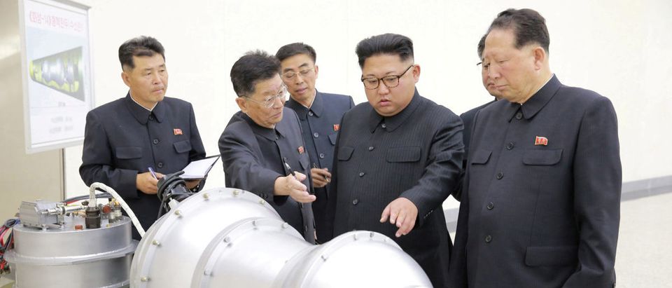 North Korean leader Kim Jong Un provides guidance with Ri Hong Sop (2nd L) and Hong Sung Mu (R) on a nuclear weapons program in this undated photo released by North Korea's Korean Central News Agency (KCNA) in Pyongyang September 3, 2017. KCNA via REUTERS