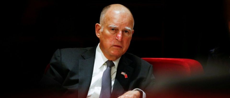 FILE PHOTO: California Governor Jerry Brown attends International Forum on Electric Vehicle Pilot Cities and Industrial Development in Beijing