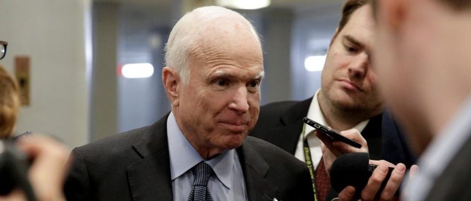 Senator John McCain (R-AZ) speaks to reporters as he arrives for a vote on Capitol Hill in Washington