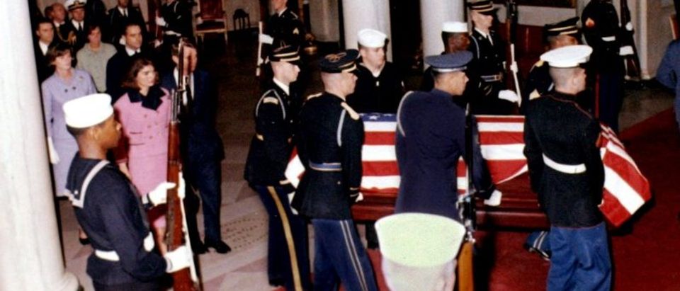 FILE PHOTO: U.S. President John F. Kennedy's widow, first lady Jacqueline Bouvier Kennedy walks into the White House grand foyer behind his casket