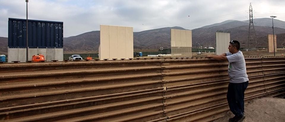A man watches across the border from Tijuana, Mexico, on October 12, 2017 a prototype of US President Donald Trump's US-Mexico border wall being built near San Diego, in the US, Following up on President Donald Trump's campaign promise to build a wall along the entire 3,200 kilometre (2,000 mile) Mexican frontier, the Department of Homeland Security began building prototypes for the barrier along the border in San Diego and Imperial counties, as it announced in August. (Photo: GUILLERMO ARIAS/AFP/Getty Images)
