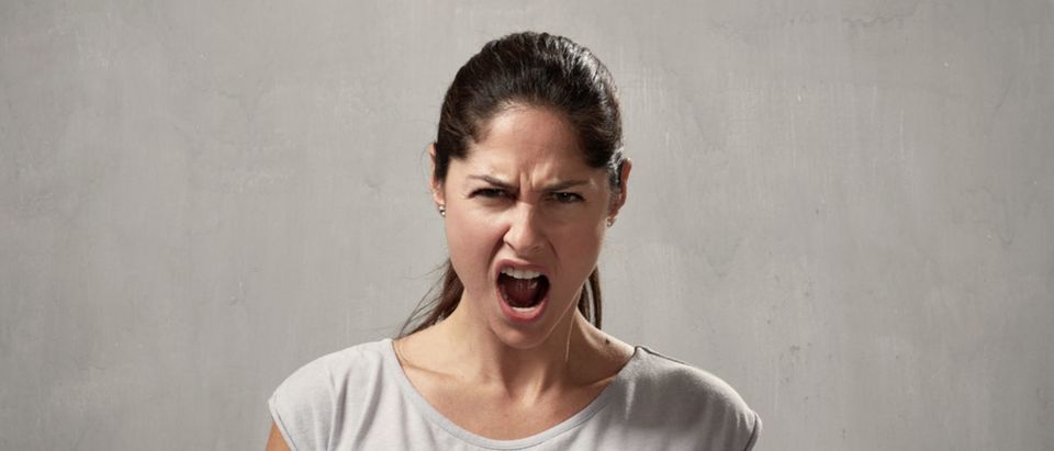 Angry woman (Shutterstock/kurhan)