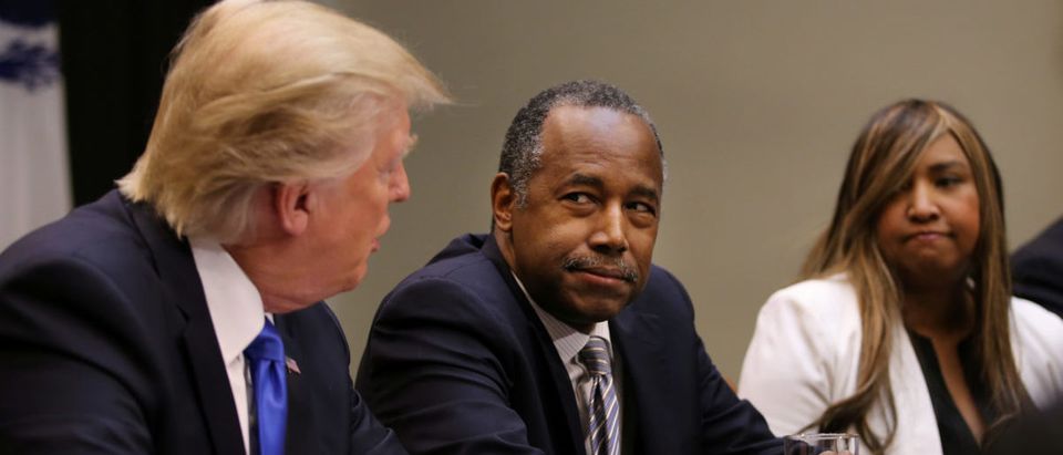 U.S. President Donald Trump attends an African American History Month listening session, accompanied by the Housing and Urban Development Secretary Ben Carson (C) at the Roosevelt room of the White House in Washington U.S., February 1, 2017. (REUTERS/Carlos Barria)
