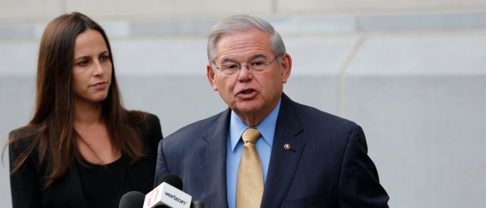 Senator Bob Menendez speaks to journalists after arriving to face trial for federal corruption charges as his daughter Alicia Menendez looks on outside United States District Court for the District of New Jersey in Newark, New Jersey, U.S., September 6, 2017. REUTERS/Joe Penney
