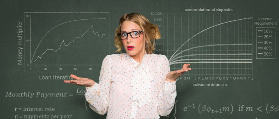 Confused teacher at blackboard (Shutterstock/El Nariz)