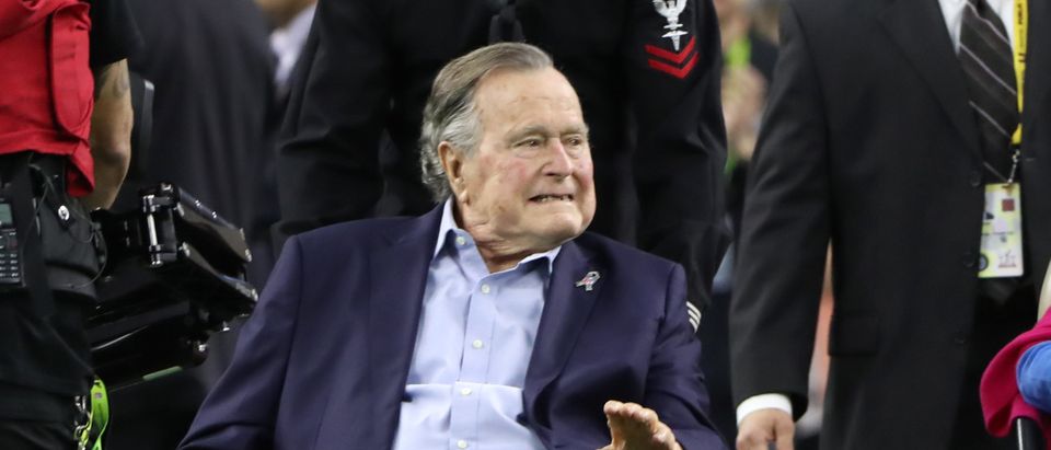 Former President George H.W. Bush and former first lady Barbara Bush arrive on the field to do the coin toss ahead of the start of Super Bowl LI between the New England Patriots and the Atlanta Falcons in Houston, on February 5, 2017. REUTERS/Adrees Latif
