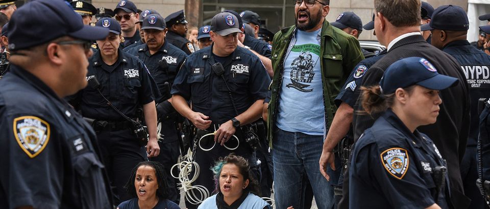 Members of the New York City police detain people protesting in support for the Deferred Action for Childhood Arrivals or DACA during the United Nations General Assembly in New York