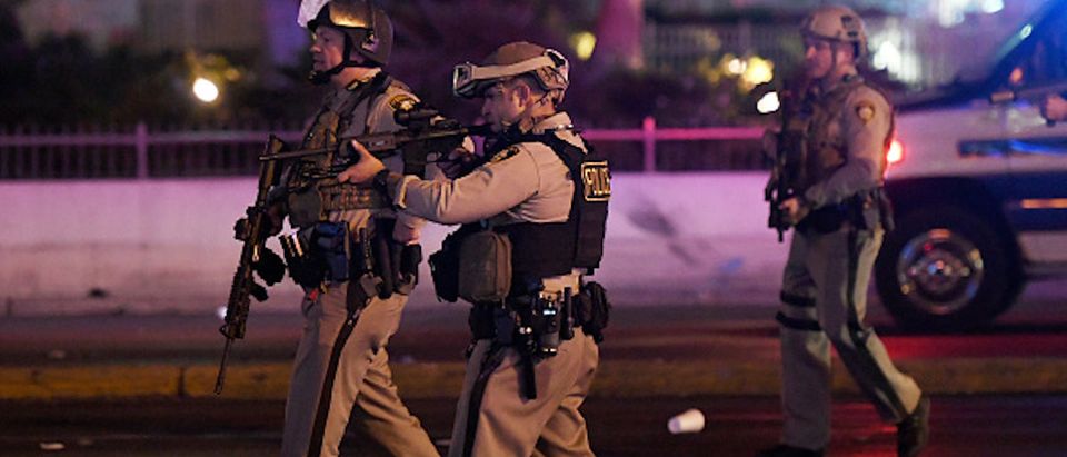 LAS VEGAS, NV - OCTOBER 02: Police officers point their weapons at a car driving down closed Tropicana Ave. near Las Vegas Boulevard after a reported mass shooting at a country music festival nearby on October 2, 2017 in Las Vegas, Nevada. A gunman has opened fire on a music festival in Las Vegas, leaving at least 2 people dead. Police have confirmed that one suspect has been shot. The investigation is ongoing. (Photo by Ethan Miller/Getty Images)
