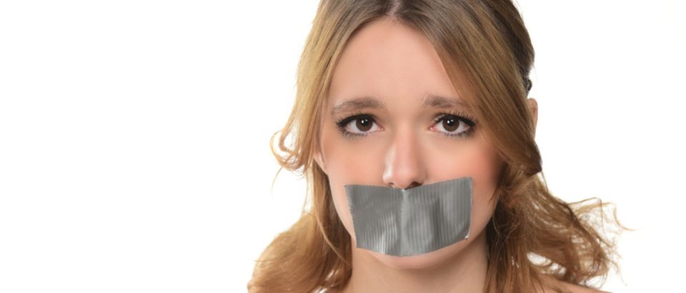 Duct tape prevents a student from speaking. (Shutterstock/junostock)