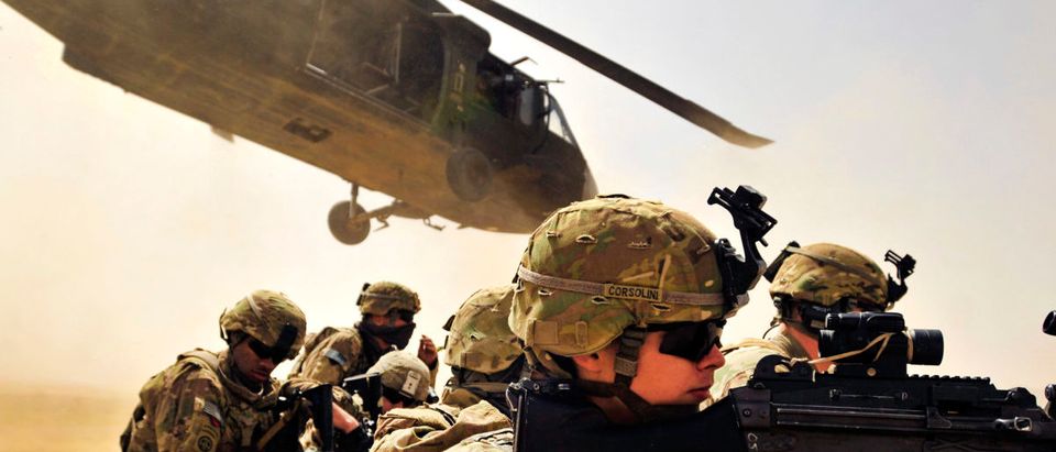 Pfc. Samuel Corsolini, a gunner assigned to F Company, 2nd Battalion, 25th Aviation Regiment, 25th Combat Aviation Brigade, pulls security with other Pathfinders as a UH-60 Black Hawk helicopter takes off after unloading his team and members of 2nd Afghan National Civil Order Patrol Special Weapons And Tactics Team during a vehicle interdiction as part of Operation Pranoo Verbena in order to disrupt Taliban operations in Kandahar province, Afghanistan, March 16. US Army/Flickr