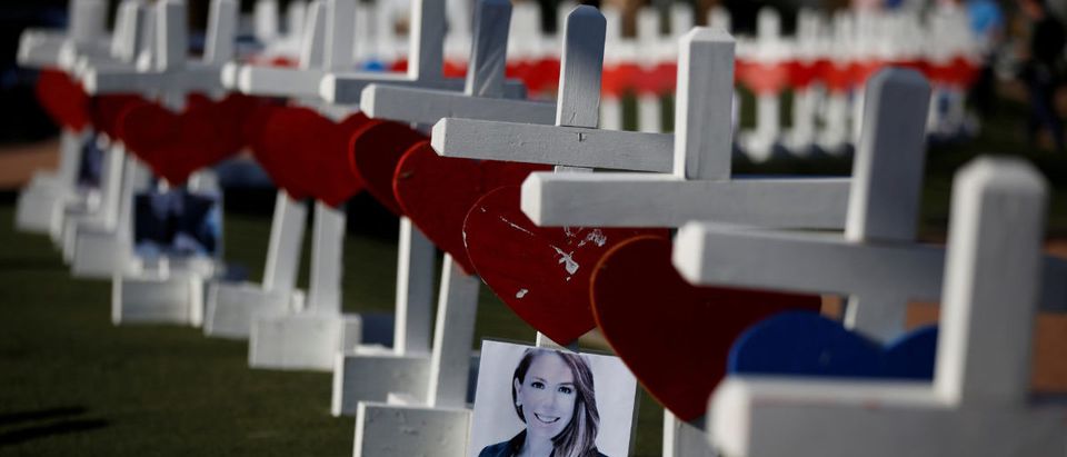 A photograph hangs from one of the 58 white crosses set up for the victims of the Route 91 music festival mass shooting in Las Vegas, Nevada, U.S., October 5, 2017. (REUTERS/Chris Wattie)
