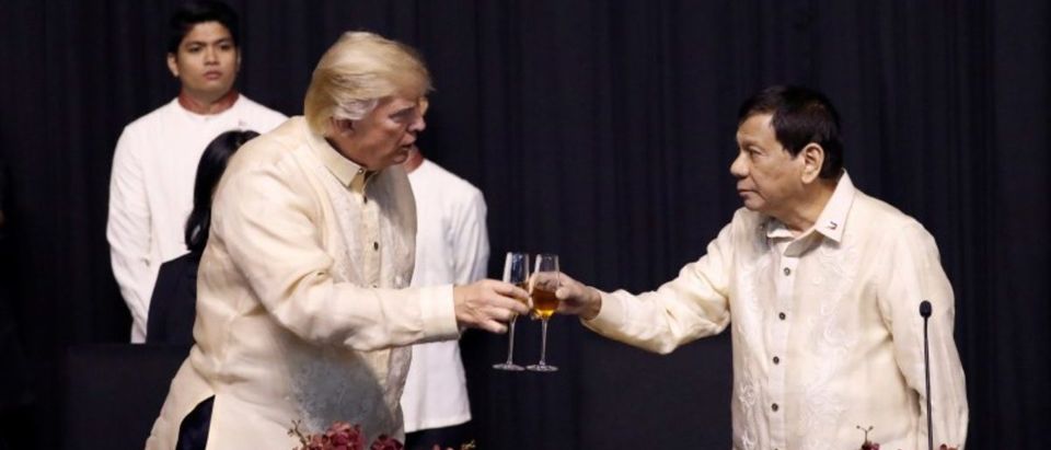 U.S. President Donald Trump toasts with Philippines President Rodrigo Duterte during the gala dinner marking ASEAN's 50th anniversary in Manila