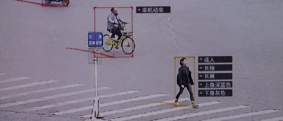 FILE PHOTO: SenseTime surveillance software identifying details about people and vehicles runs as a demonstration at the company's office in Beijing