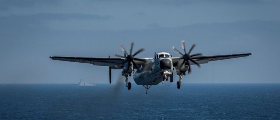 FILE PHOTO: A C-2A Greyhound prepares to land on the flight deck aboard the aircraft carrier USS Theodore Roosevelt