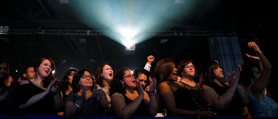 Audience members cheer as U.S. Democratic presidential nominee Hillary Clinton speaks at the Congressional Hispanic Caucus Institute's 39th Annual Gala Dinner in Washington, DC, U.S. September 15, 2016. REUTERS/Brian Snyder