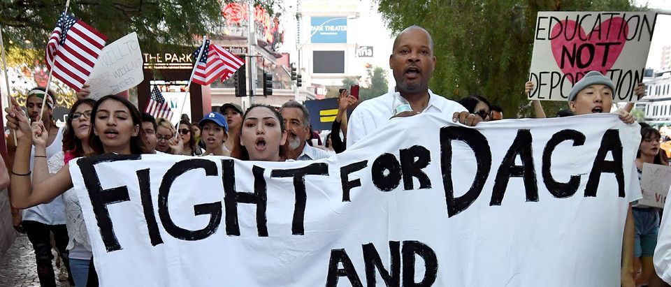 Nevada Senate Majority Leader Aaron D. Ford (D-Las Vegas) (3rd L) joins immigrants and supporters as they march on the Las Vegas Strip during a "We Rise for the Dream" rally to oppose U.S. President Donald Trump's order to end DACA on September 10, 2017 in Las Vegas, Nevada. The Obama-era Deferred Action for Childhood Arrivals program protects young immigrants who grew up in the U.S. after arriving with their undocumented parents from deportation to a foreign country. Trump's executive order removes protection for about 800,000 current "dreamers," about 13,000 of whom live in Nevada. Congress has the option to replace the policy with legislation before DACA expires on March 5, 2018. (Photo by Ethan Miller/Getty Images)