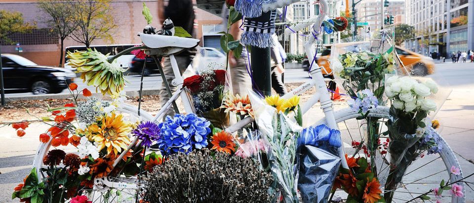 Flowers are placed on a bike at a memorial at the scene of Tuesday's terrorist attack along a bike path in lower Manhattan on November 2, 2017 in New York City. (Photo by Spencer Platt/Getty Images)