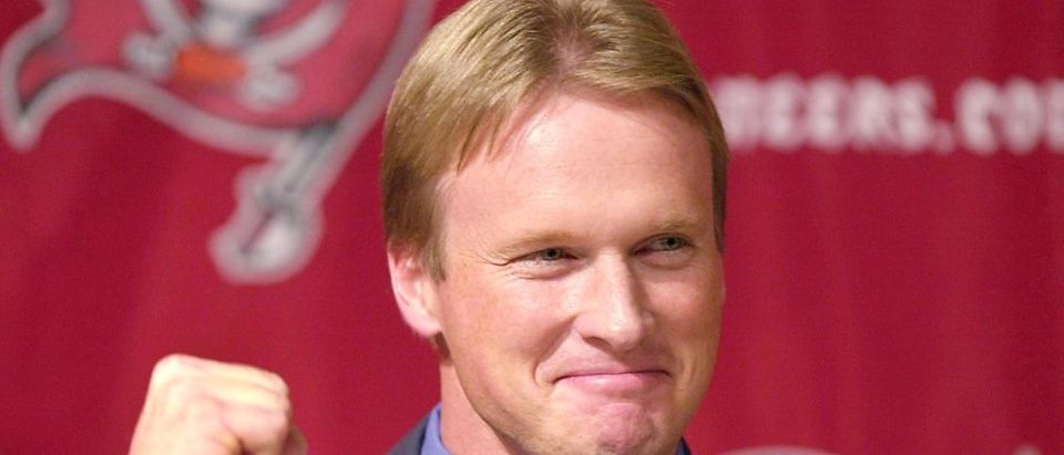 Tampa Bay Buccaneers' new Head Coach Jon Gruden celebrates as he is introduced at a press conference 20 Febuary 2002 in Tampa, Florida. (Photo: PETER MUHLY/AFP/Getty Images)