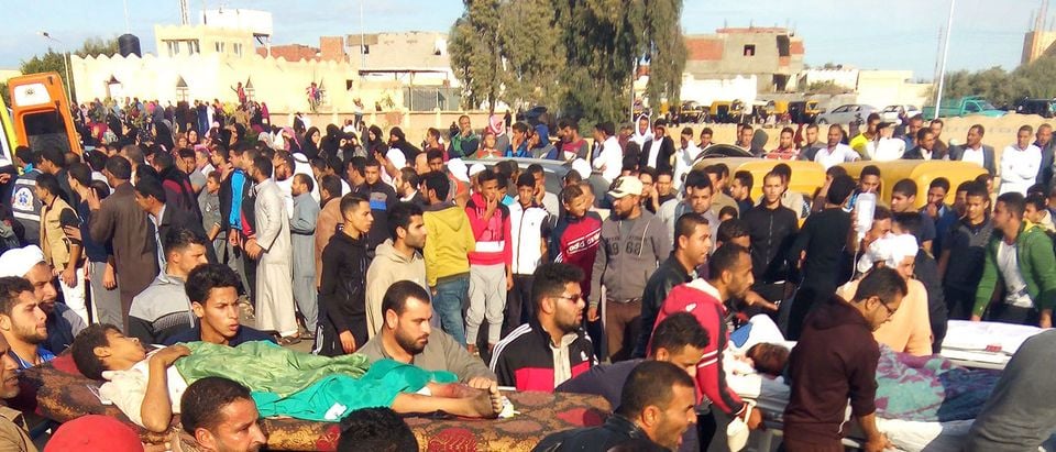 Egyptians carry victims on stretchers following a gun and bombing attack on the Rawda mosque near the North Sinai provincial capital of El-Arish on November 24, 2017. Armed attackers killed at least 235 worshippers in a bomb and gun assault on the packed mosque in Egypt's restive North Sinai province, in the country's deadliest attack in recent memory. /AFP/Getty Images