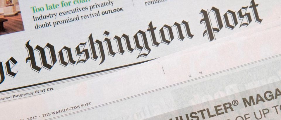 A photo taken on October 15, 2017 in in Washington, DC shows a full-page newspaper advertisement in the Washington Post offering 10 million dollars from Hustler Magazine publisher Larry Flynt for information leading to the impeachment and removal from office of US President Donald Trump. (Photo: SAUL LOEB/AFP/Getty Images)