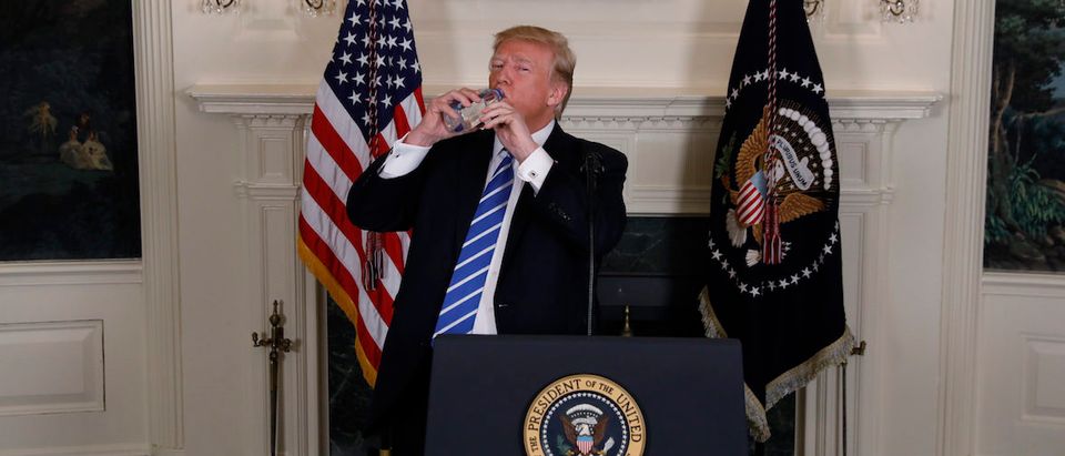 U.S. President Trump takes a drink of water while speaking at the White House in Washington