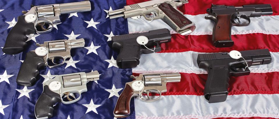 Here is a photo of guns and a flag. (Photo: Shutterstock/ja-images)
