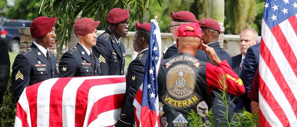 An honor guard carries the coffin of U.S. Army Sergeant La David Johnson, who was among four special forces soldiers killed in Niger, at a graveside service in Hollywood