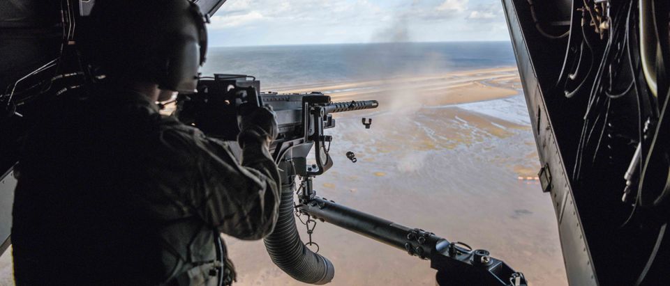 An Air Commando from the 7th Special Operations Squadron, 352d Special Operations Wing fires a .50 caliber machine gun aboard a CV-22 Osprey during a flight around southern England in September 2017. (U.S. Air Force photo by Staff Sgt. Philip Steiner)