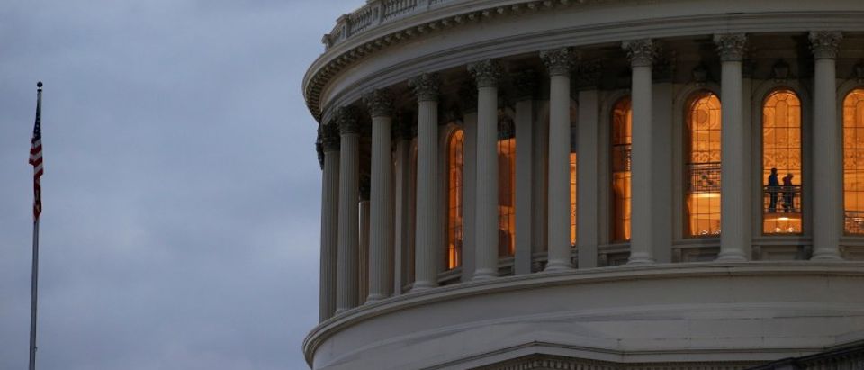 The U.S. Capitol building is lit at dusk ahead of planned votes on tax reform in Washington
