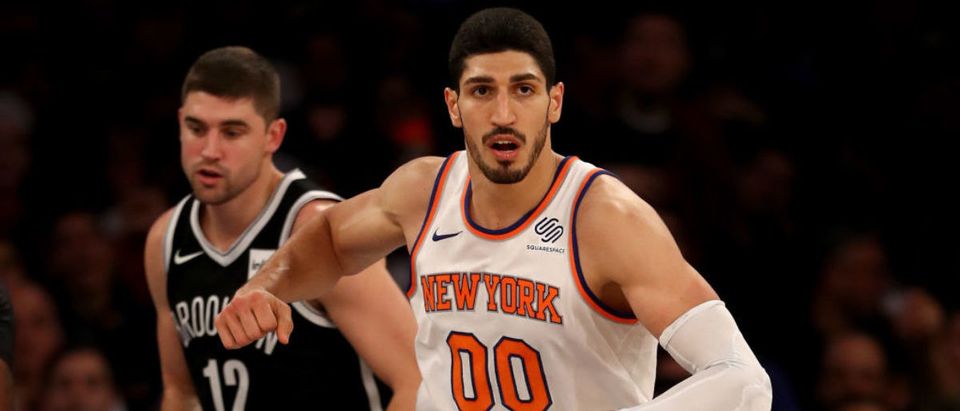 Enes Kanter #00 of the New York Knicks celebrates his basket in the second half as Joe Harris #12 of the Brooklyn Nets looks on at Madison Square Garden on October 27, 2017 in New York City. (Photo by Elsa/Getty Images)