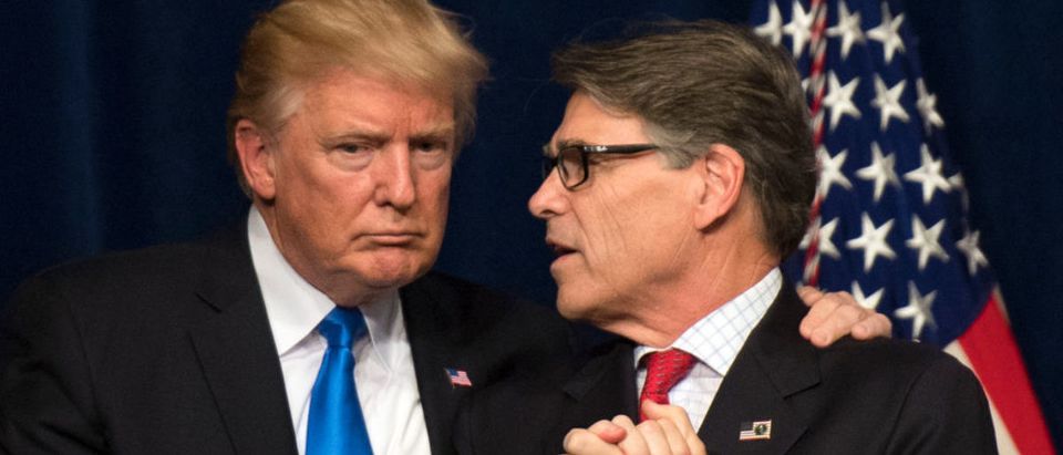 WASHINGTON, DC - JUNE 29: (AFP OUT) U.S. President Donald Trump (L) embraces Energy Secretary Rick Perry after Trump delivered remarks on at the Unleashing American Energy event at the Department of Energy on June 29, 2017 in Washington, DC. Trump announced a number on initiatives including his Administration's plan on rolling back regulations on energy production and development. (Photo by Kevin Dietsch-Pool/Getty Images)