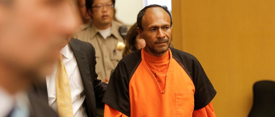 FILE PHOTO: Jose Ines Garcia Zarate is led into the Hall of Justice for his arraignment in San Francisco