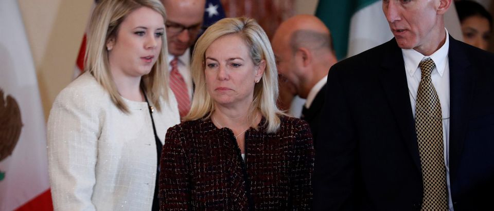 Department of Homeland Security Secretary Kirstjen Nielsen looks for her seat prior to a meeting to discuss strategies to disrupt transnational criminal organizations at the State Department in Washington