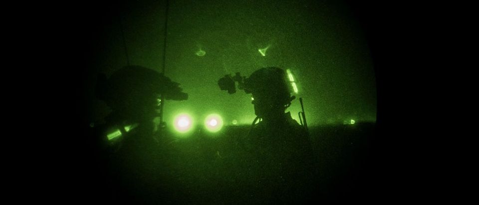 Members of the United States Army Special Forces Operational Detachment Alpha through a night vision goggle during casevac night training of Afghanistan Special Forces on September 10, 2017 at Camp Shorab in Helmand Province, Afghanistan. (Photo: Andrew Renneisen/Getty Images)