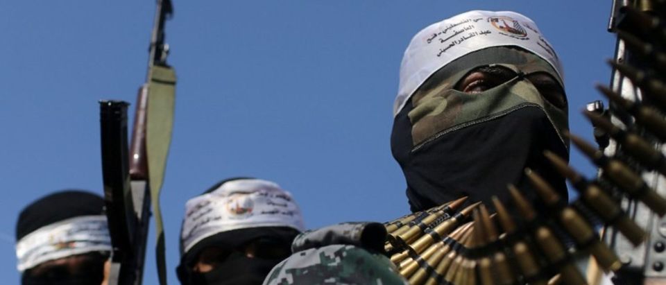 Hamas militants attend the funeral of a 16-year-old Palestinian in centre Gaza Strip