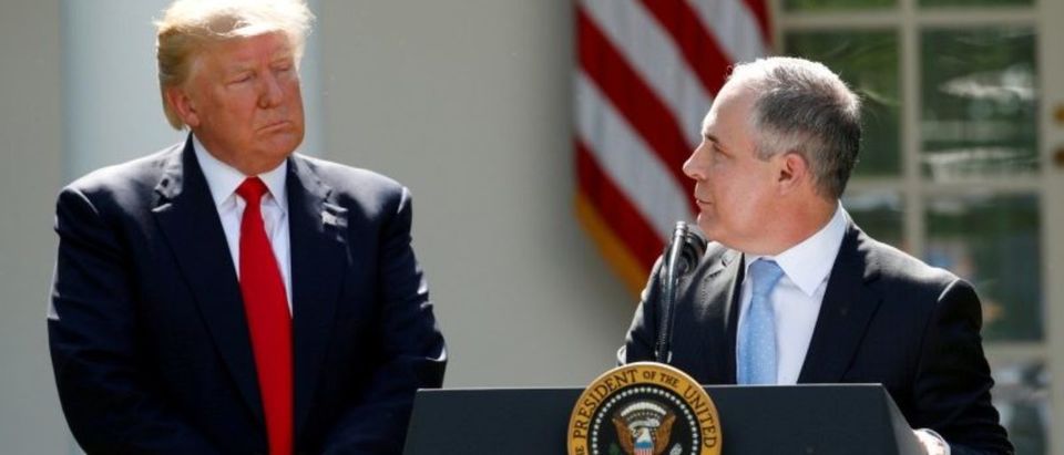 FILE PHOTO: U.S. President Trump listens to EPA Administrator Pruitt after announcing decision to withdraw from Paris Climate Agreement in Washington