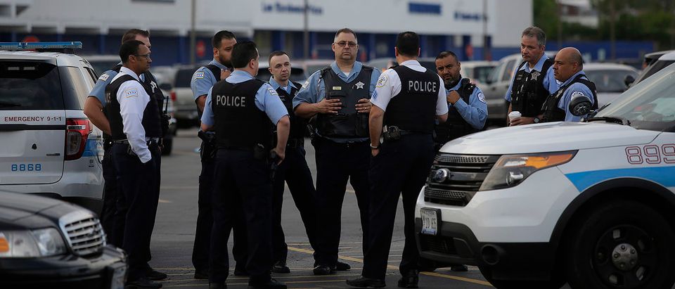 The Chicago Police Department added 1,300 extra officers around the city to patrol the streets for the Memorial Day holiday weekend. JOSHUA LOTT/AFP/Getty Images