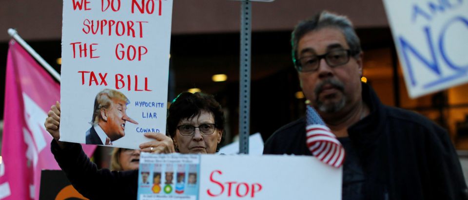 Demonstrators protest against the federal government tax reform in front of the federal building in San Diego,