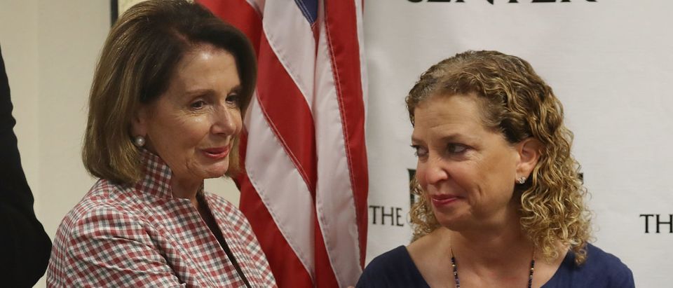 WILTON MANORS, FL - MAY 26: House Minority Leader Rep. Nancy Pelosi (D-CA) and Rep. Debbie Wasserman Schultz (D-FL) attend a discussion about LGBT rights at the Pride Center on May 26, 2017 in Wilton Manors, Florida. The discussion centered around the Equality Act, a bill that hopes to amend the Civil Rights Act of 1964 to guarantee protections to LGBT individuals. (Photo by Joe Raedle/Getty Images) | Congress, DWS Violated Cyber Protocol