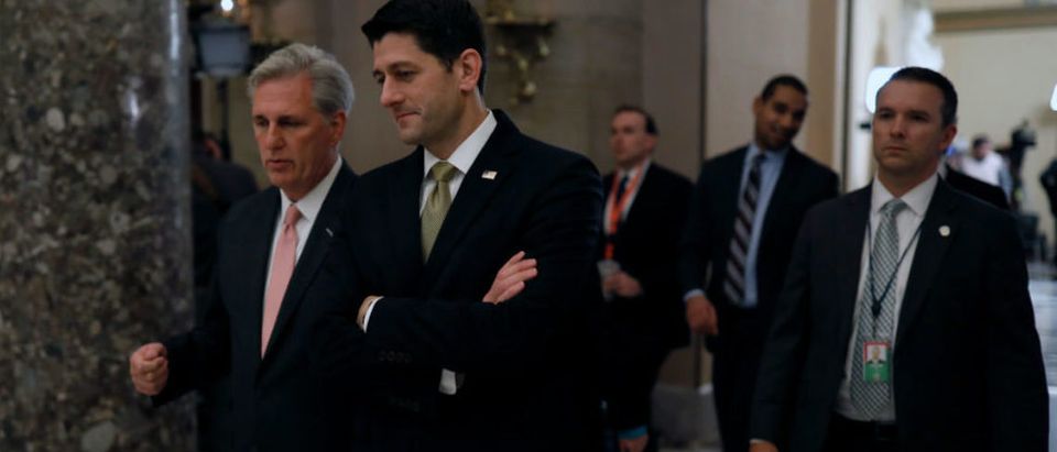 WASHINGTON, DC - JANUARY 18: Speaker of the House Paul Ryan, at right, and House Majority Leader Kevin McCarthy speak as they walk to a news conference at the U.S. Capitol January 18, 2018 in Washington, DC. A continuing resolution to fund the government has passed the House of Representatives but faces a stiff challenge in the Senate. (Photo by Aaron P. Bernstein/Getty Images)