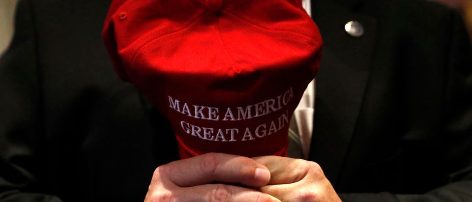 A supporter holds a Trump hat in his hands at Republican U.S. presidential nominee Donald Trump's election night rally in Manhattan, New York, U.S., November 9, 2016. REUTERS/Andrew Kelly