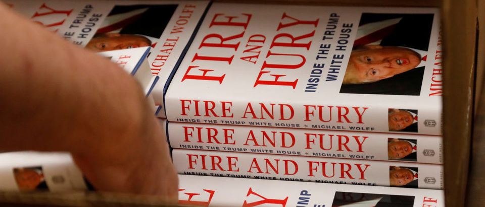 An employee of Book Culture book store unloads copies of "Fire and Fury: Inside the Trump White House" by author Michael Wolff inside the store in New York