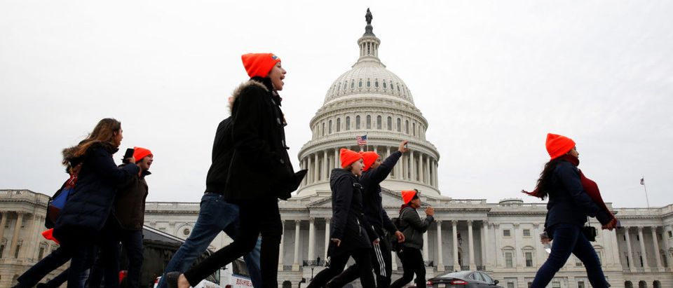 Protesters who call for an immigration bill addressing the so-called Dreamers, young adults who were brought to the United States as children, rally on Capitol Hill in Washington, U.S., December 20, 2017. REUTERS/Joshua Roberts