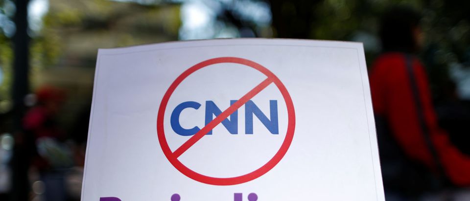A placard that reads, "CNN, Irresponsible journalism" is seen during a gathering to support Maduros government order of suspension of CNN's Spanish-language service, in Caracas