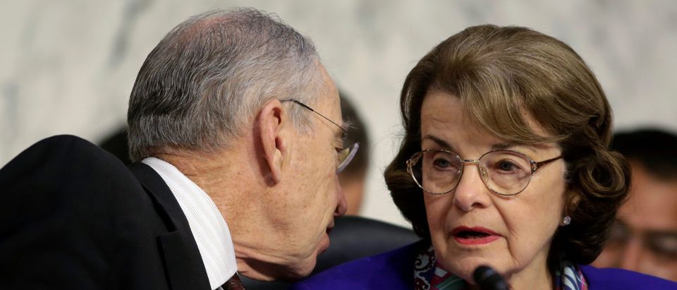 Senate Judiciary Committee Chairman Chuck Grassley (R-IA) speaks to Senator Dianne Feinstein (D-CA) as U.S. Attorney General Jeff Sessions (not pictured) testifies before a Senate Judiciary oversight hearing on the Justice Department on Capitol Hill in Washington, U.S., October 18, 2017. REUTERS/Joshua Roberts