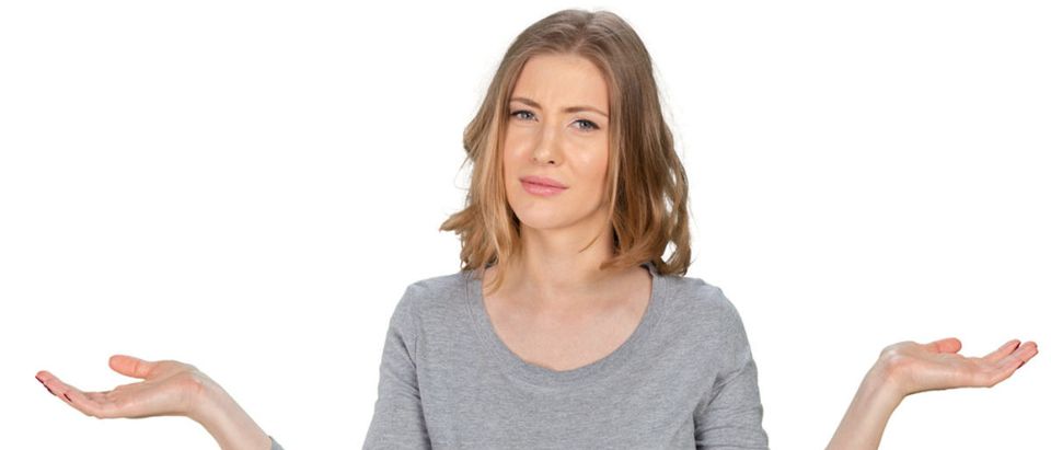 Confused woman wonders what is up. (Shutterstock/FabrikaSimf)