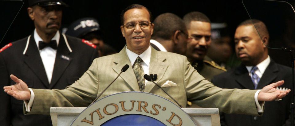 Nation of Islam leader Louis Farrakhan closes his address to the annual Saviors' Day convention in Detroit