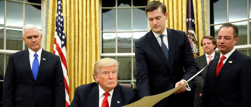 FILE PHOTO: Porter hands document to Trump during signing ceremony in the Oval Office in Washington